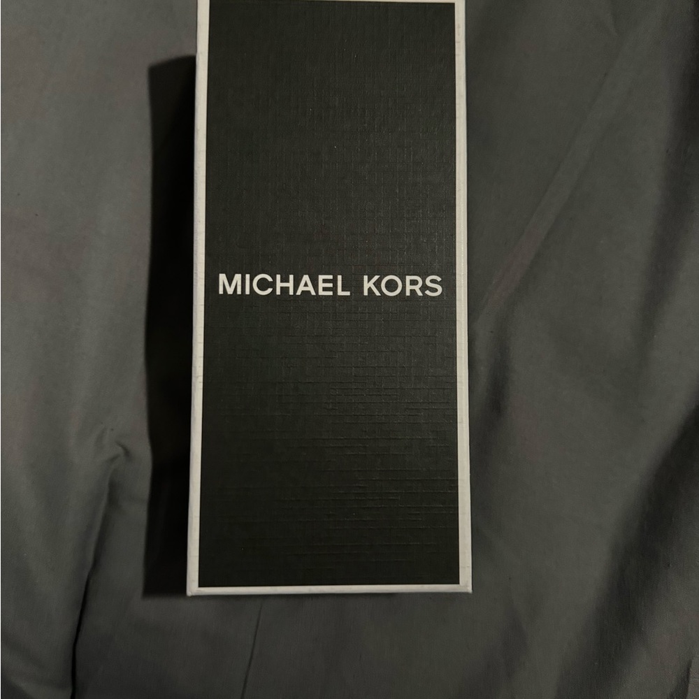 Michael Kors Airpod holder with lanyard. Brand new